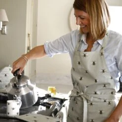 Bees Adult Apron -Sophie Allport all36250 bees adult apron lifestyle high res square 9ae990d5 5e70 442b 9a2c 12b146abc5ba