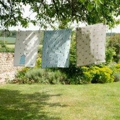 Bees Teal Tea Towel -Sophie Allport all80601set lin36601 bees teal and bees linen tea towel set of 2 lifestyle high res square 4e830453 2e85 48f4 b168 93af688be0b3