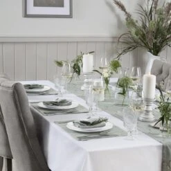 Boxing Hares Fabric Placemat -Sophie Allport boxing hares table setting with chairs lifestyle high res square 9445eaac d232 4376 8840 821ac6256df4