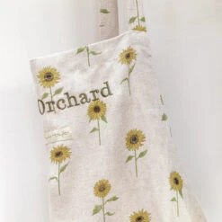 Sunflower Linen Adult Apron 10 Sunflower Linen Adult Apron -Sophie Allport ss23 sunflower lin108250 apron personalisation detail1 square